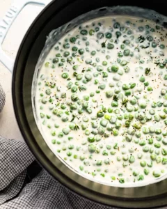 Delicious creamed peas served in a bowl, perfect side dish for any meal.