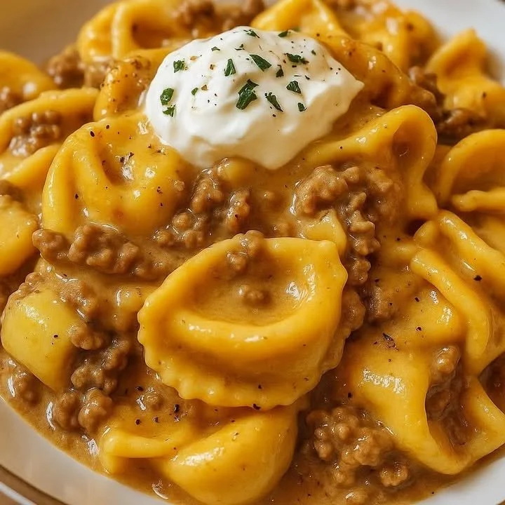 Creamy Beef Tortellini Skillet ready to serve with fresh toppings.
