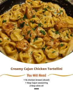 Creamy Cajun Chicken Tortellini in a bowl garnished with herbs