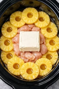 Creamy chicken dip served in a bowl with tortilla chips on the side