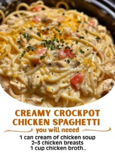Creamy crockpot chicken spaghetti in a white bowl with herbs on top.
