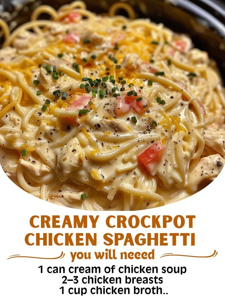 Creamy crockpot chicken spaghetti in a white bowl with herbs on top.