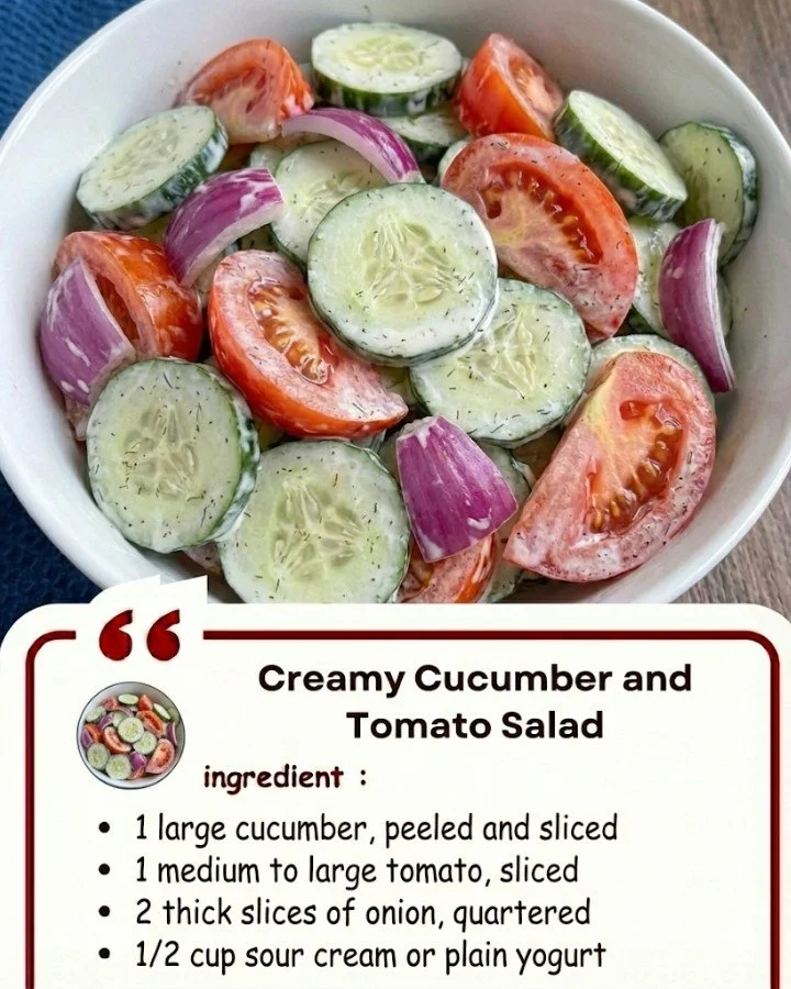 Creamy Cucumber and Tomato Salad in a bowl with fresh herbs and dressing