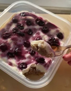 Creamy dreamy blueberry bowl topped with fresh blueberries and granola