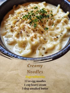 Delicious creamy noodles served in a bowl with herbs and spices.