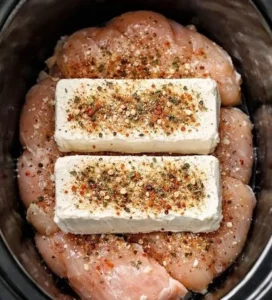 Creamy slow cooker chicken dish served with vegetables