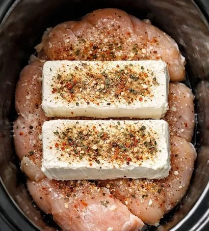 Creamy slow cooker chicken dish served with vegetables