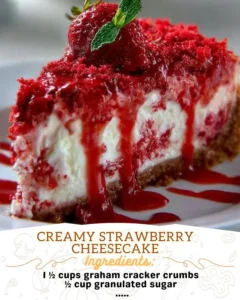 A delicious slice of creamy strawberry cheesecake topped with fresh strawberries.