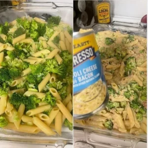 Creamy tuna broccoli pasta served on a plate with garnished vegetables.