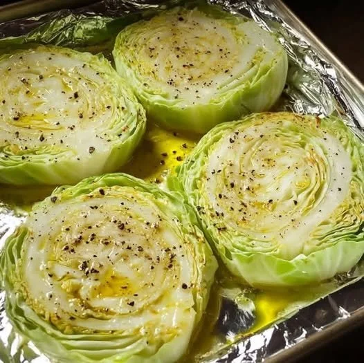 Crispy baked cabbage steaks served on a plate