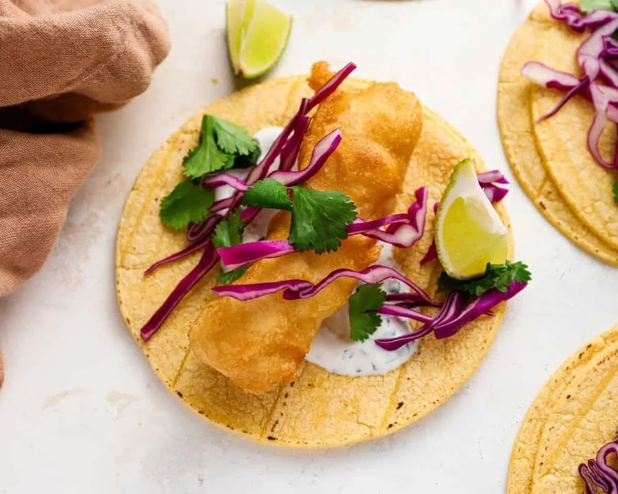 Delicious crispy beer battered fish tacos served with fresh toppings