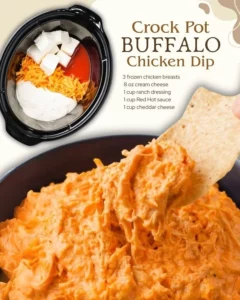 Crockpot Buffalo Chicken Dip served with tortilla chips on a wooden table