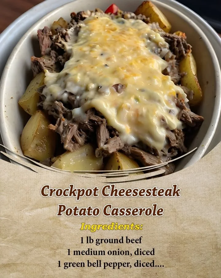 Crockpot cheesesteak potato casserole topped with cheese and veggies.