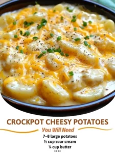 Crockpot Cheesy Potatoes served in a bowl with melted cheese