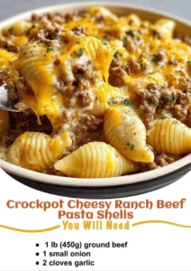 Crockpot Cheesy Ranch Beef Pasta Shells dish with creamy ingredients.