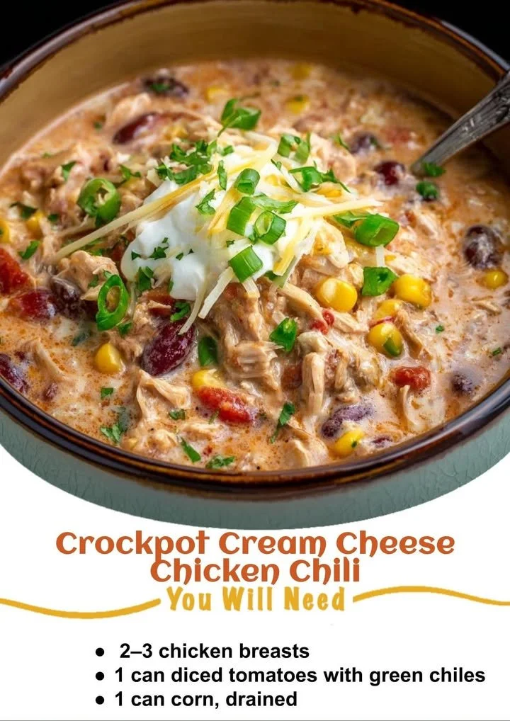 A bowl of Crockpot cream cheese chicken chili topped with fresh herbs