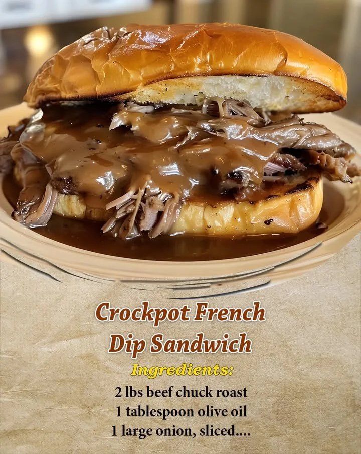 Crockpot French Dip Sandwich with beef and dipping sauce in a crusty roll