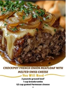 Crockpot French Onion Meatloaf with melted Swiss cheese served on a plate