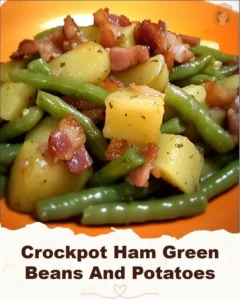 Delicious crockpot ham served with green beans and potatoes in a cozy setting