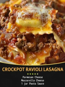 Crockpot Ravioli Lasagna served in a dish with melted cheese and fresh herbs.