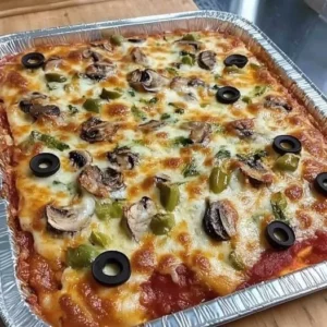 Delicious crustless pizza bake topped with cheese and fresh vegetables