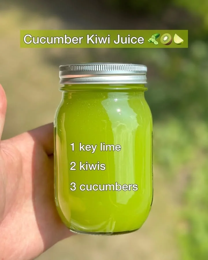 Freshly made Cucumber Kiwi Juice in a glass with cucumber slices and kiwi.