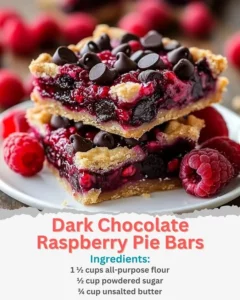 Slices of dark chocolate raspberry pie bars on a rustic wooden table.