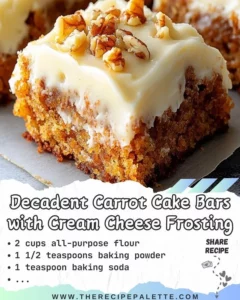Delicious carrot cake bars with cream cheese frosting on a plate