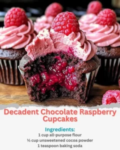 Decadent Chocolate Raspberry Cupcakes topped with fresh raspberries and chocolate frosting.