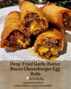Delicious deep-fried garlic butter bacon cheeseburger egg rolls served on a plate