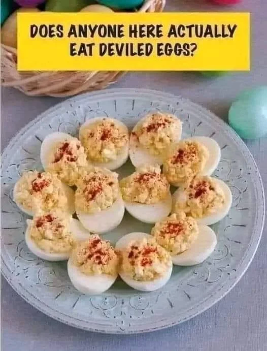Delicious deviled eggs garnished with paprika on a white plate