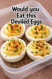 Delicious deviled eggs garnished with paprika and herbs, perfect for appetizers.