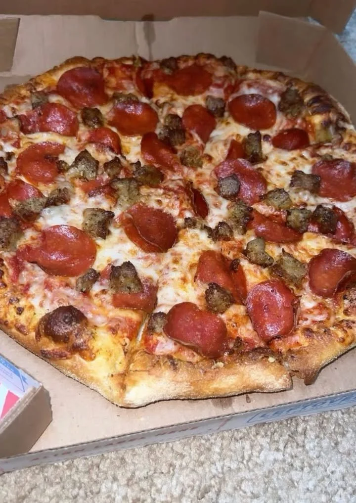 Delicious Domino's Pizza with fresh toppings and a golden crust
