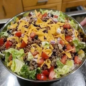 Savory Dorito Taco Salad with fresh ingredients and crunchy Doritos on top