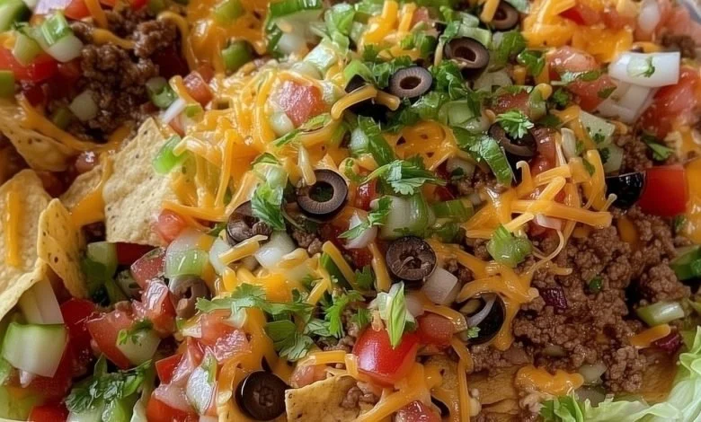 Delicious Dorito Taco Salad topped with crunchy Doritos and fresh vegetables