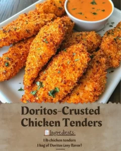 Doritos-Crusted Chicken Tenders served on a plate with dipping sauce.
