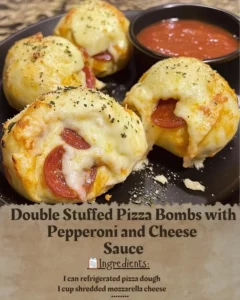 Double stuffed pizza bombs with pepperoni and cheese sauce on a plate