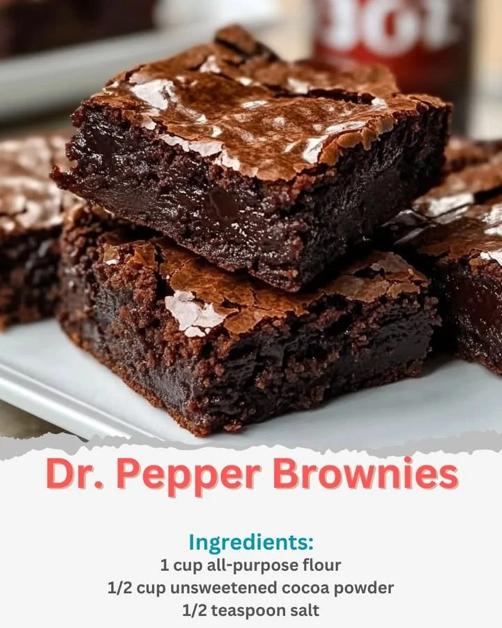 Delicious Dr. Pepper brownies served on a plate with chocolate drizzle.