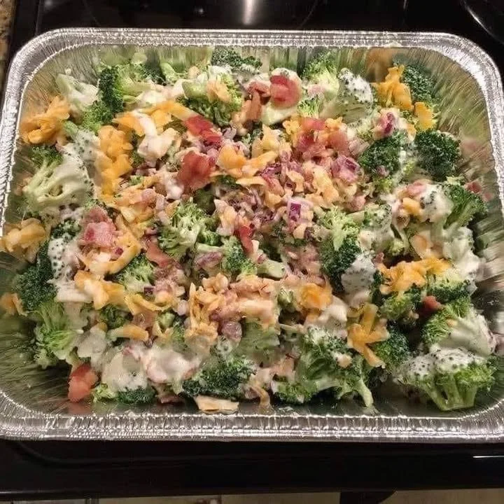 Delicious easy broccoli salad with nuts, cranberries, and dressing