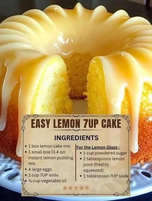 A slice of moist Lemon 7UP Cake garnished with lemon zest and glaze.