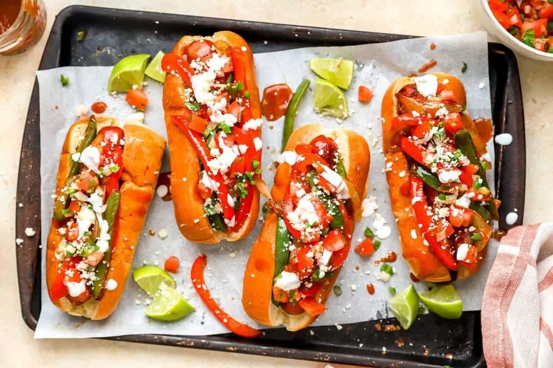 Delicious easy Mexican hot dogs with toppings ready to serve.
