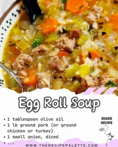 Bowl of homemade egg roll soup with colorful vegetables and herbs
