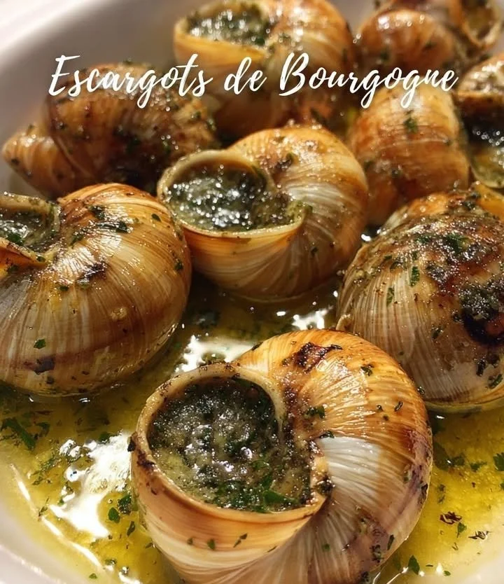 Plate of Burgundy Snails (Escargots de Bourgogne) prepared in garlic butter.