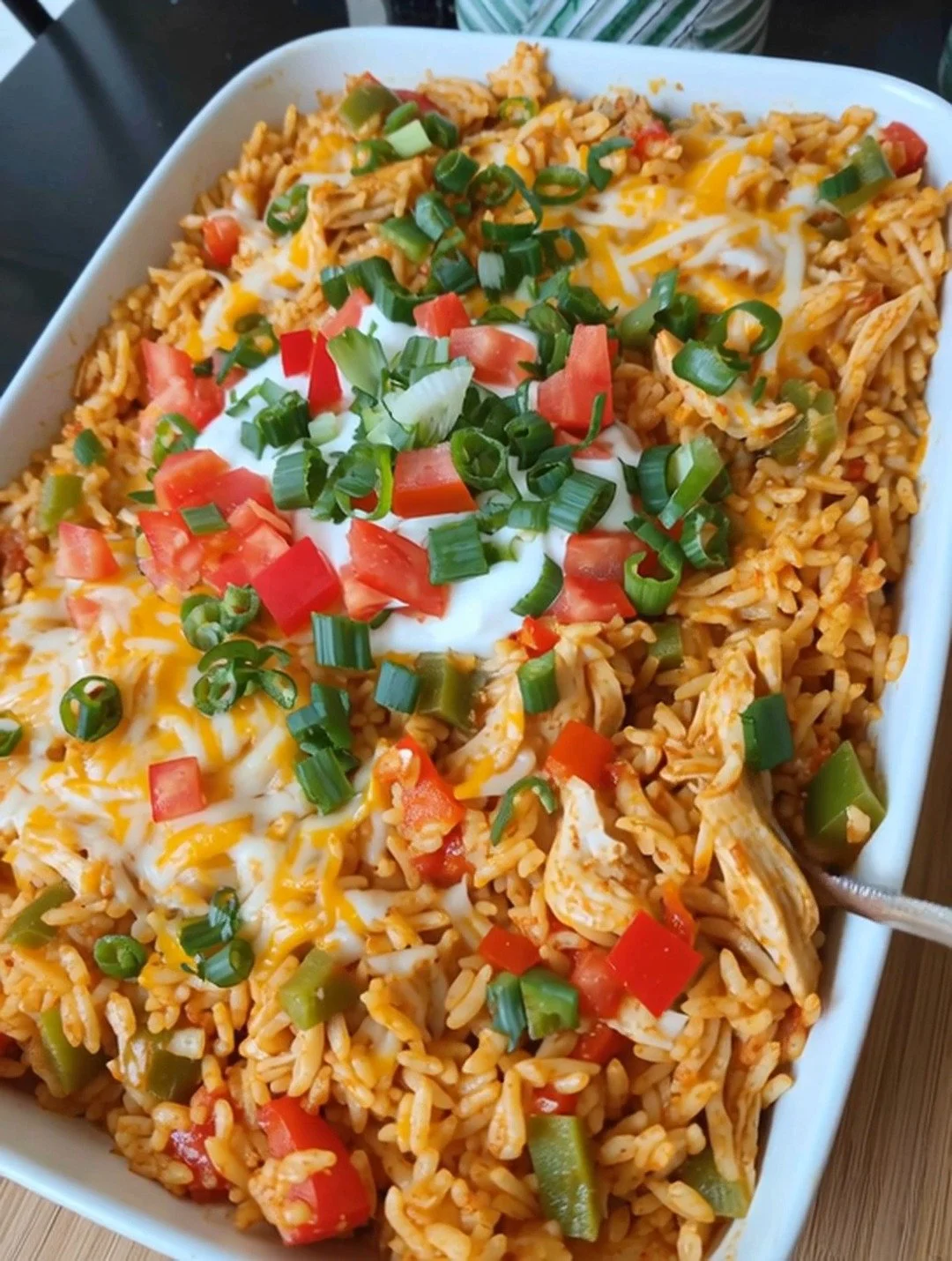Fajita Chicken Casserole Bake topped with colorful peppers and cheese