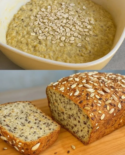 Loaf of freshly baked oatmeal bread on a wooden cutting board