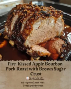 Fire-Kissed Apple Bourbon Pork Roast with a brown sugar crust on a serving plate