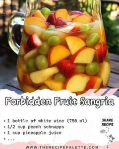 A glass of Forbidden Fruit Sangria with vibrant fruits and wine