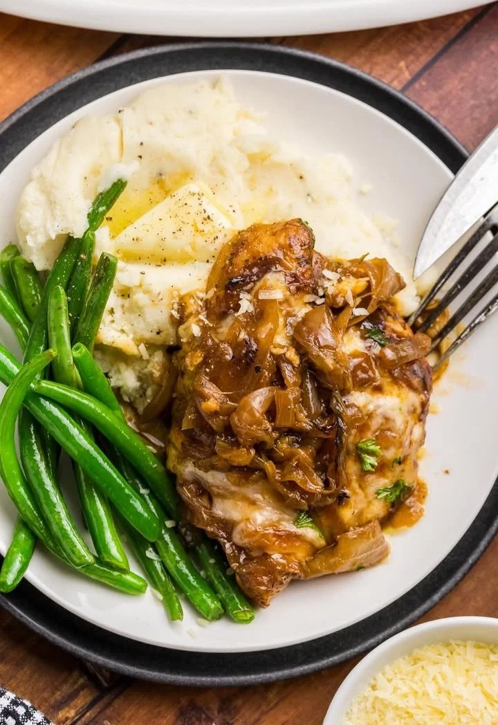 French Onion Chicken Bake topped with melted cheese and caramelized onions
