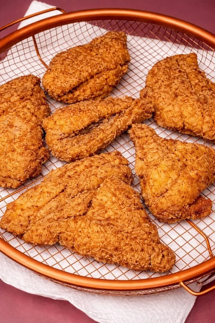 Delicious plate of fried catfish served with sides