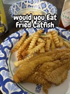 Deliciously crispy Fried Catfish served with tartar sauce and lemon wedges.